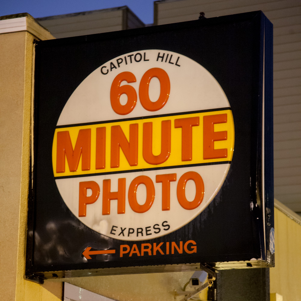 This is the sign on the corner outside 60 Minute Photo